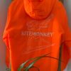 Orange Kitemonkey windproof jacket for kitesurfing, wingfoiling and watersports