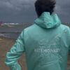 Turquoise Kitemonkey windproof watersports jacket designed to wear over a wetsuit
