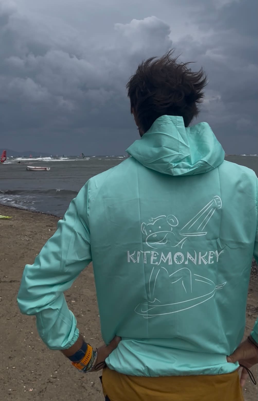 Turquoise Kitemonkey windproof watersports jacket designed to wear over a wetsuit