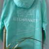 Turquoise Kitemonkey windproof watersports jacket designed to wear over a wetsuit